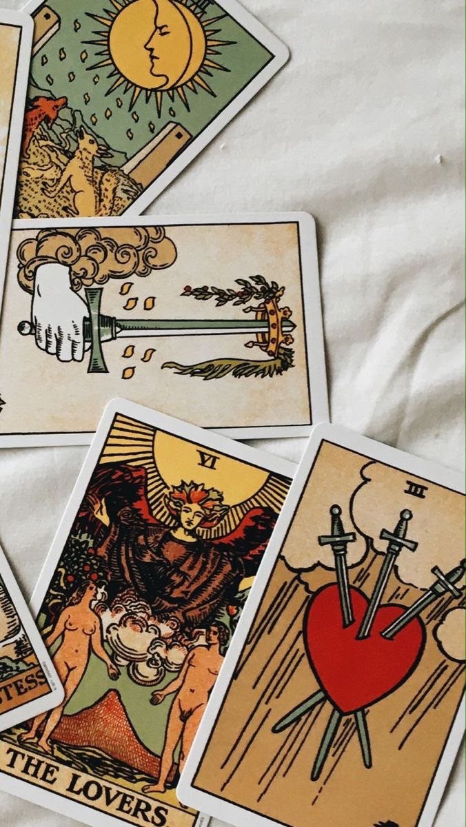 The Lovers and Three of Swords tarot cards